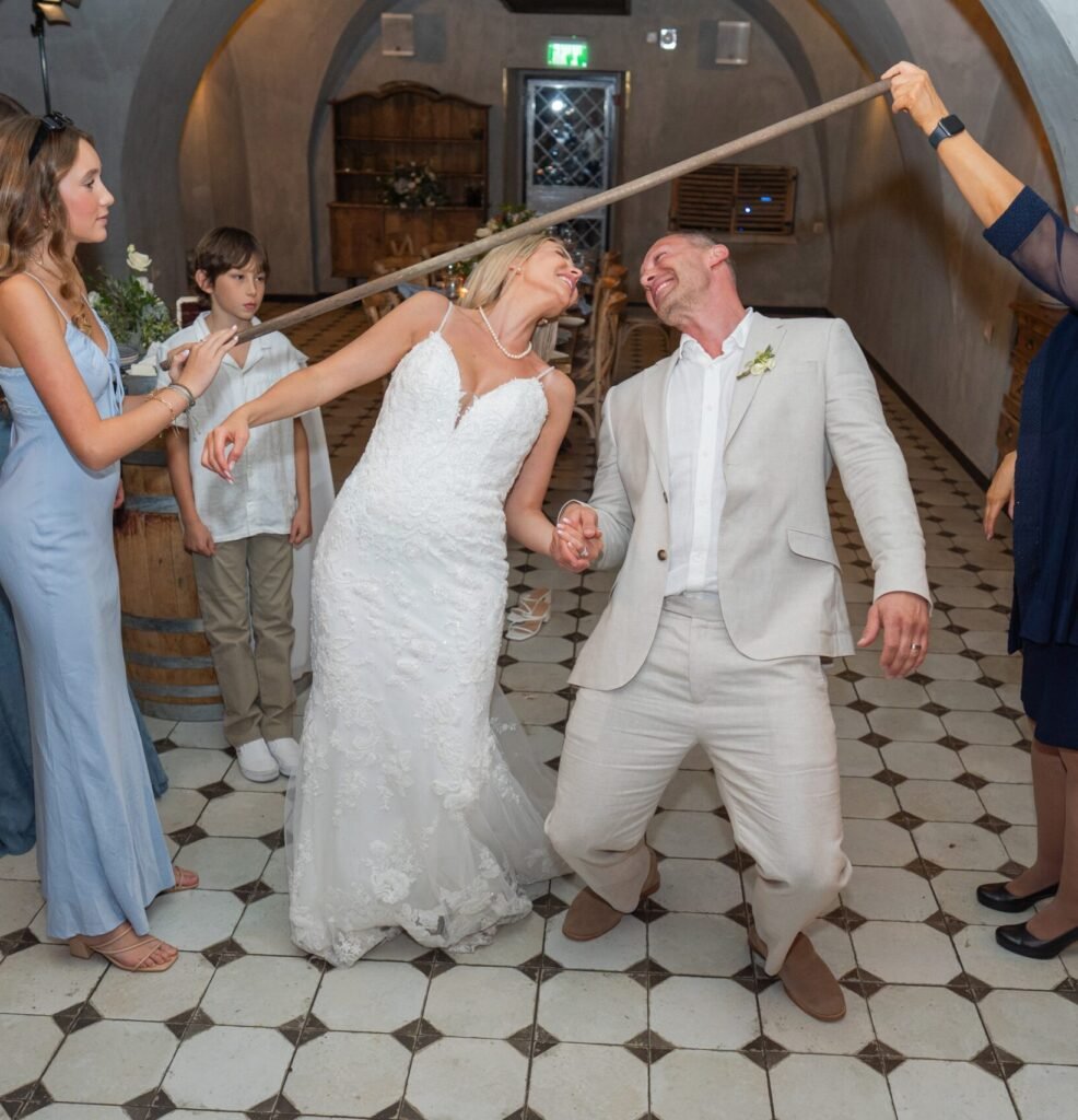 dancing doing the limbo at our wedding in Jerusalem Israel