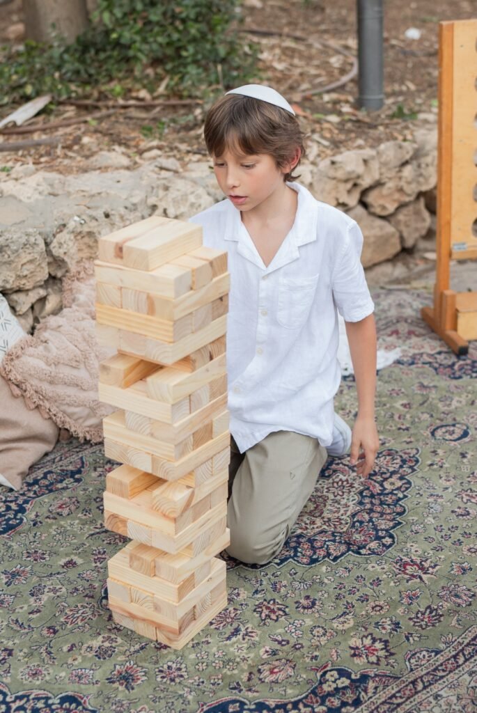 our son playing jumbo jenga at our wedding in Jerusalem Israel
