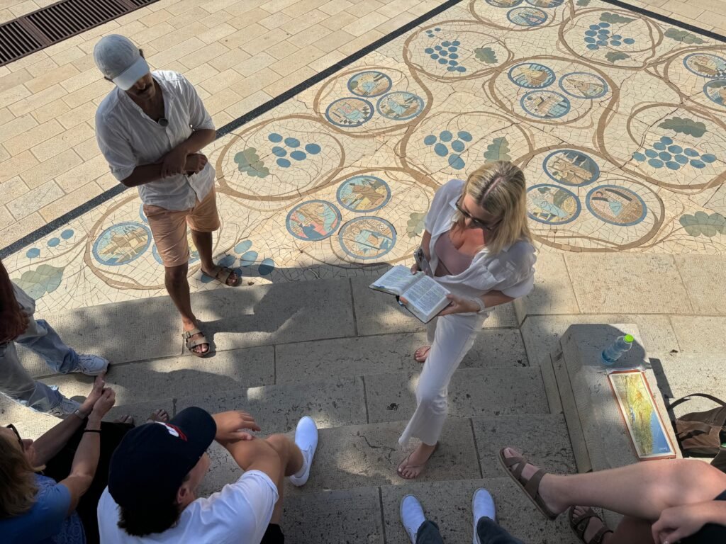 reading the bible at the mount of olives on the Sea of Galilee Israel